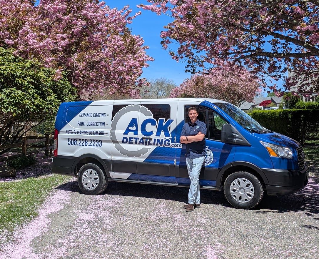 ACK Detailing van in a Nantucket driveway under cherry blossoms