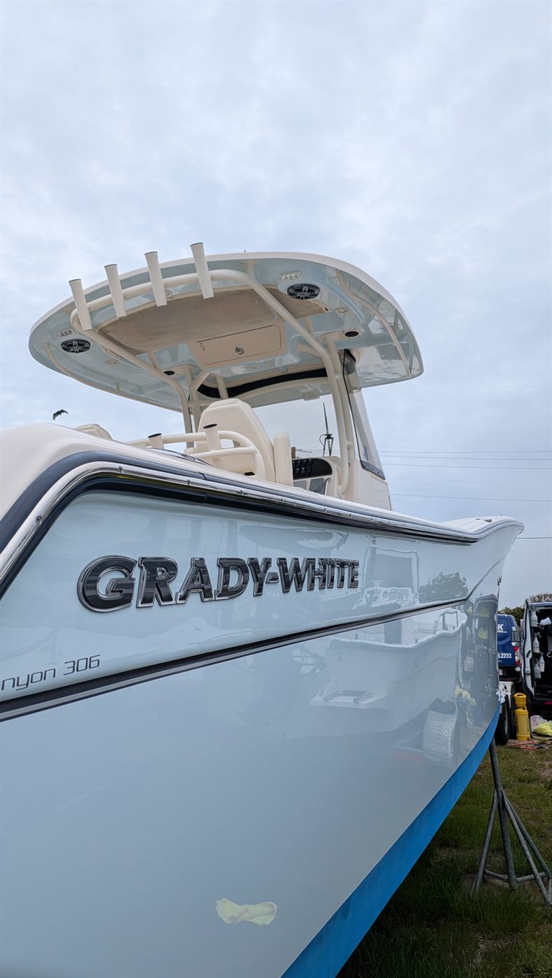 Light blue Grady-White Canyon 306 hull, oxidation polished out and ceramic coated