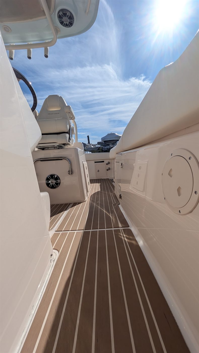Side deck and console of a Grady-White after a full detail and ceramic coating