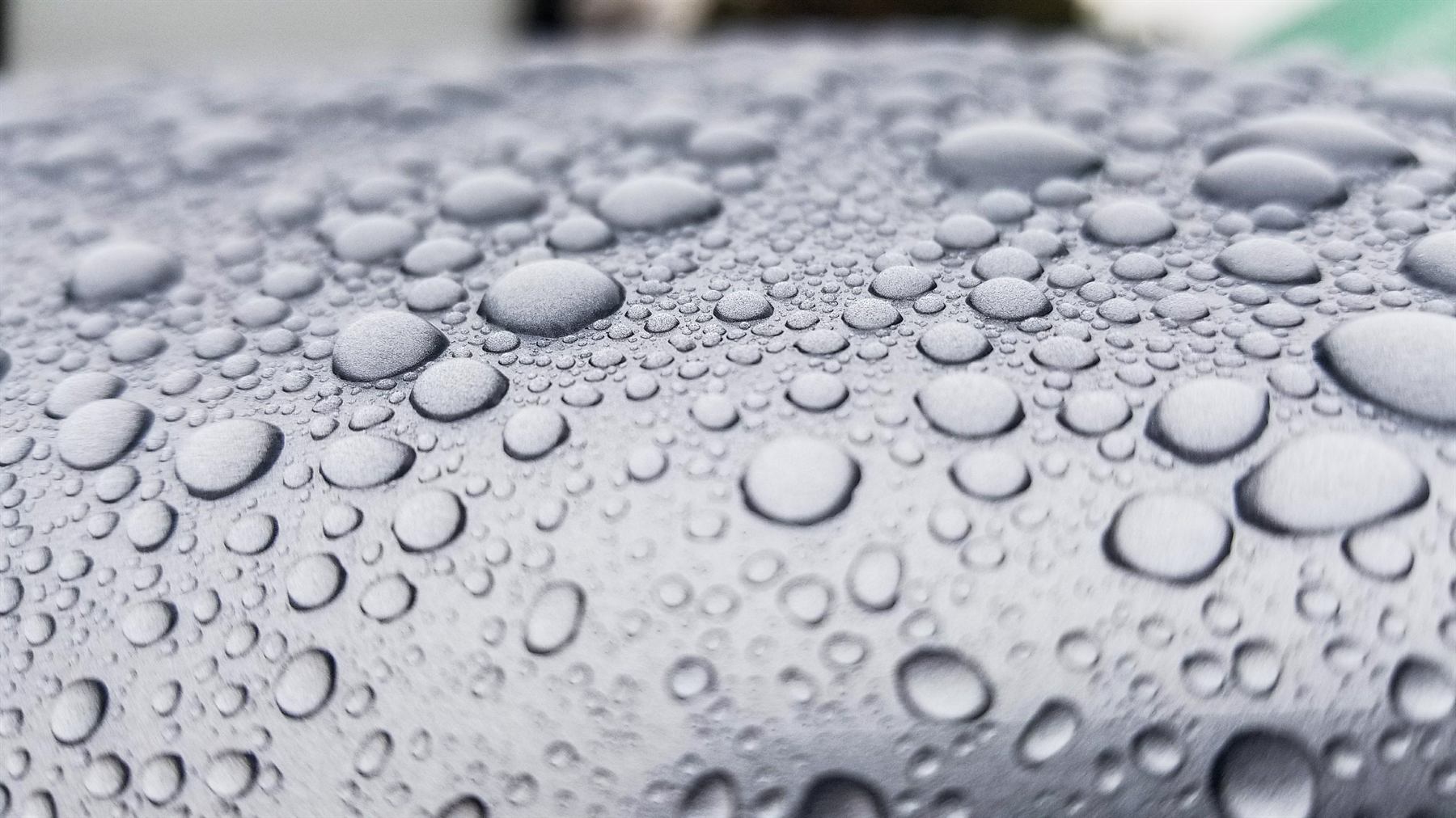 Water beading tightly on a hydrophobic ceramic coated panel